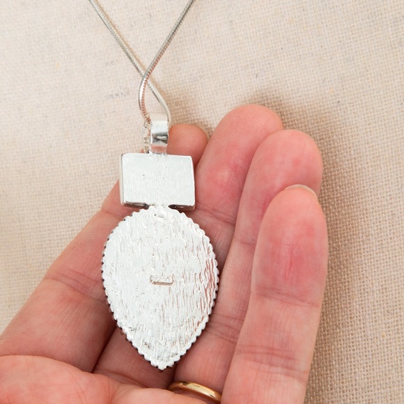 Southwestern pendant turquoise look pear stone, silver look accents Roman stamp - Picture 10 of 11